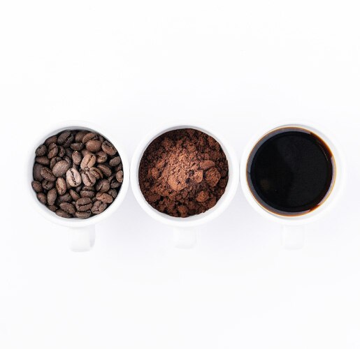 3 cups with different stages of grounded coffee